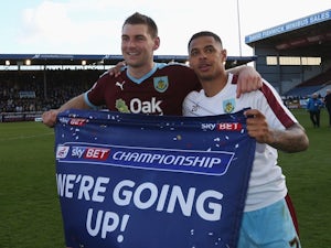 Sam Vokes and Andre Gray of Burnley celebrate as they are promoted to the Premier League after the Championship against Queens Park Rangers at Turf Moor on May 2, 2016