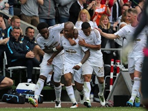 Andre Ayew celebrates scoring during the Premier League game between Swansea City and Manchester City on May 15, 2016