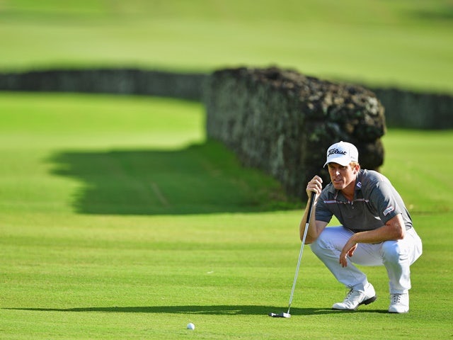 Andrew Dodt lines up a putt during the first round of AfrAsia Bank Mauritius Open on May 12, 2016