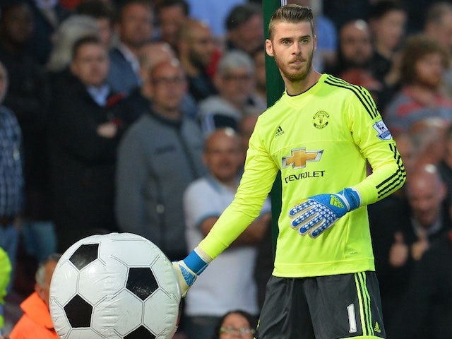 David de Gea catches an inflatable ball during the Premier League game between West Ham United and Manchester United on May 10, 2016