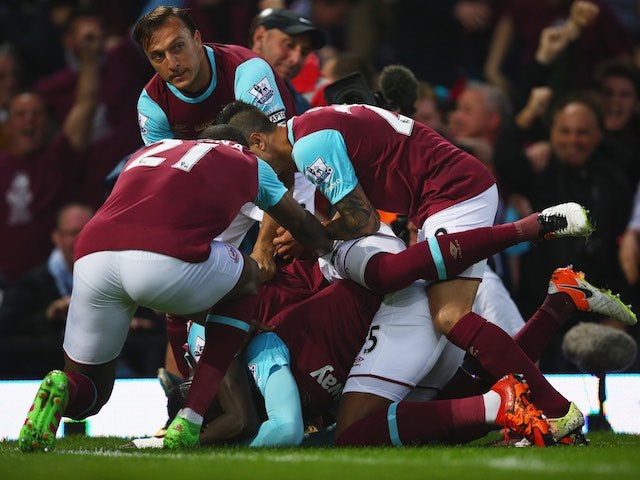 Diafra Sakho is quite literally violated from all angles after scoring during the Premier League game between West Ham United and Manchester United on May 10, 2016