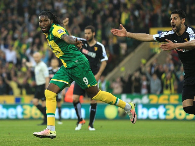 Norwich City striker Dieumerci 'no, thank you' Mbokani is chased by a rabid Miguel Britos after scoring against Watford on May 11, 2016