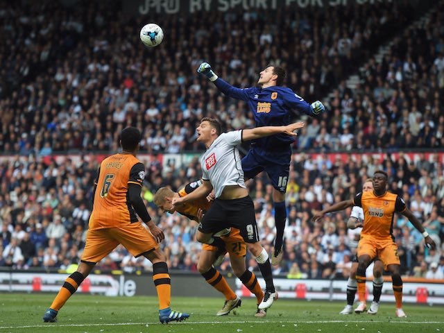 Eldin Jakupovic punches clear a Chris Martin shot during the Championship playoff semi-final between Derby County and Hull City on May 14, 2016