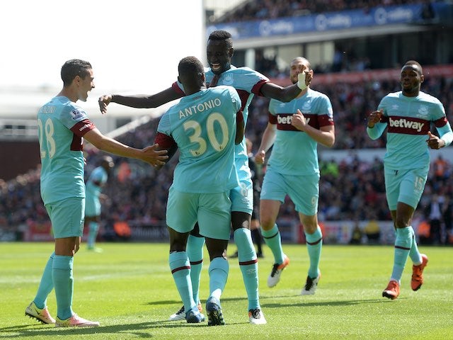 Michail Antonio celebrates scoring during the Premier League game between Stoke City and West Ham United on May 15, 2016