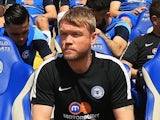 Grant McCann looks on from the bench prior to the League One match between Peterborough United and Blackpoo on May 8, 2016