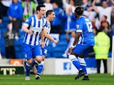Lewis Dunk of Brighton & Hove Albion celebrates with Gaetan Bong as he scores their first goal during the Championship playoff semi-final second leg against Sheffield Wednesday on May 16, 2016