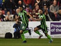 Lyle Taylor of AFC Wimbledon celebrates with teammate Callum Kennedy after scoring a goal in the first period of extra time to give his team a 3-2 aggregate lead during the League Two playoffs second leg against Accrington Stanley on May 18, 2016