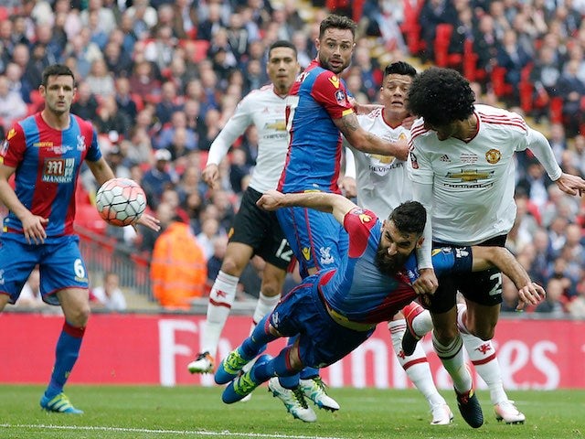 Marouane Fellaini beats Mile Jedinak to the ball during the FA Cup final between Crystal Palace and Manchester United on May 21, 2016