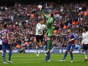 Wayne Hennessey punches clear a shot from Chris Smalling during the FA Cup final between Crystal Palace and Manchester United on May 21, 2016