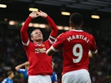 Wayne Rooney of Manchester United celebrates with Anthony Martial as he scores their first goal against Bournemouth at Old Trafford on May 17, 2016