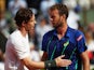 Andy Murray consoles the defeated Mathias Bourgue on day four of the French Open at Roland Garros on May 25, 2016