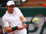 Andy Murray goes for a backhand during his French Open fourth round meeting with John Isner at Roland Garros on May 29, 2016