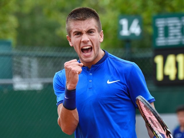 Borna Coric celebrates winning a point during the second round of the French Open on May 26, 2016