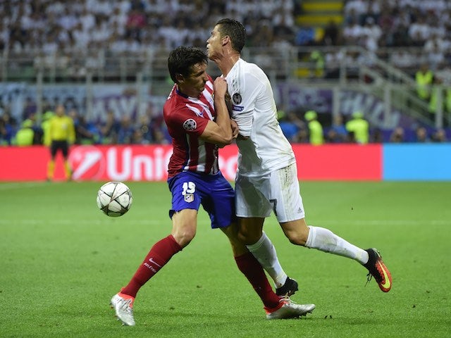 Cristiano Ronaldo clashes with Stefan Savic during the Champions League final between Real Madrid and Atletico Madrid on May 28, 2016