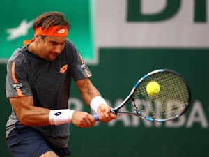 Ferrer recovers to reach third round