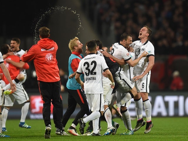 Eintracht Frankfurt's players celebrate after the Bundesliga second-leg relegation football match against Nuremberg on May 23, 2016