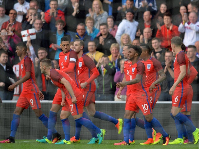 England players congratulate Marcus Rashford's debut goal during the 2-1 win over Australia at the Stadium of Light on May 27, 2016