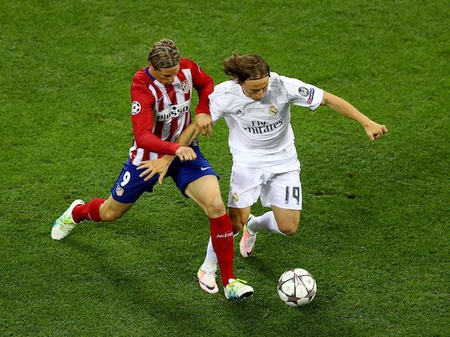Fernando Torres and Luka Modric in action during the Champions League final between Real Madrid and Atletico Madrid on May 28, 2016