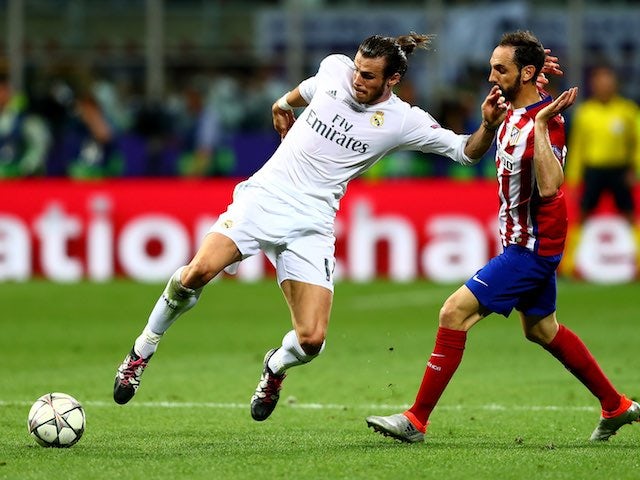 Gareth Bale holds off Juanfran during the Champions League final between Real Madrid and Atletico Madrid on May 28, 2016