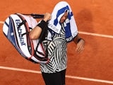 Jo-Wilfried Tsonga walks off the court after retiring during the French Open on May 28, 2016