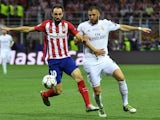 Juanfran and Karim Benzema in action during the Champions League final between Real Madrid and Atletico Madrid on May 28, 2016