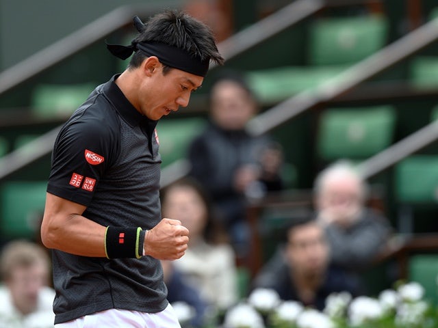 Kei Nishikori celebrates after winning against Simone Bolelli at the French Open in Paris on May 23, 2016