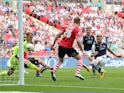 Millwall's Mark Beevers pulls a goal back for his side during their League One playoff final against Barnsley at Wembley on May 29, 2016