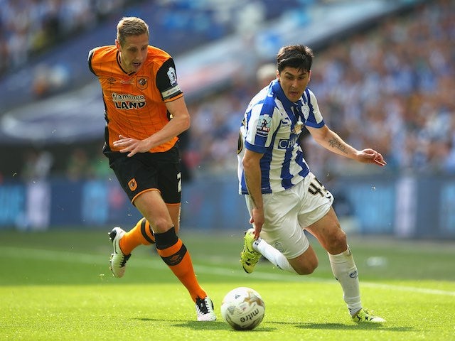 Michael Dawson and Fernando Forestieri in action during the Championship playoff final between Hull City and Sheffield Wednesday on May 28, 2016