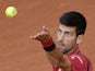 Novak Djokovic serves the ball to Lu Yen-Hsun during their men's first-round match at the French Open in Paris on May 24, 2016