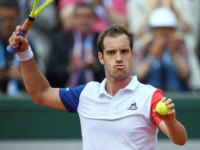 Richard Gasquet reacts after beating Bjorn Fratangelo at the French Open in Paris on May 25, 2016