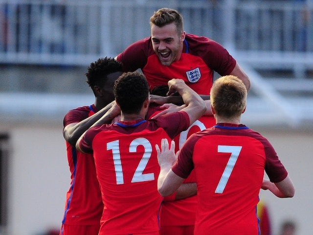 Calum Chambers jumps on top as Ruben Loftus-Cheek celebrates his second goal with teammates during the game between Paraguay under-23s and England under-21s on May 25, 2016