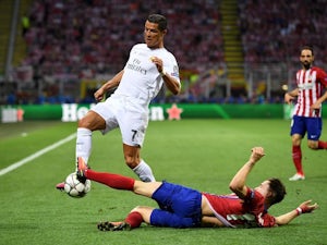 Saul Niguez and Cristiano Ronaldo in action during the Champions League final between Real Madrid and Atletico Madrid on May 28, 2016