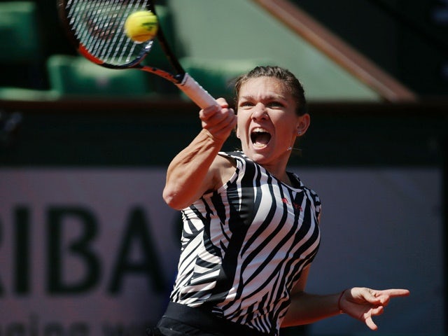 Simona Halep returns the ball to Zarina Diyas during their women's second-round match at the French Open on May 25, 2016