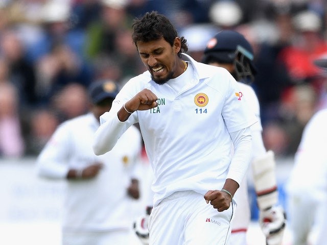 Suranga Lakmal celebrates dismissing Chris Woakes during day two of the second Test between England and Sri Lanka on May 28, 2016