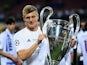 Toni Kroos poses with the trophy after the Champions League final between Real Madrid and Atletico Madrid on May 28, 2016