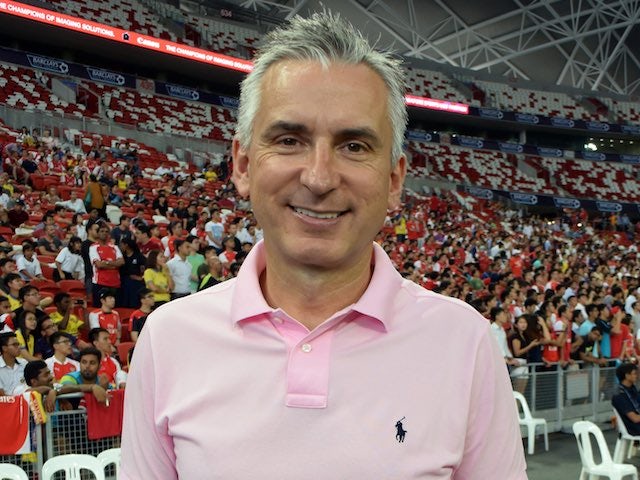 Alan Smith pictured in a fetching pink tee in July 2015