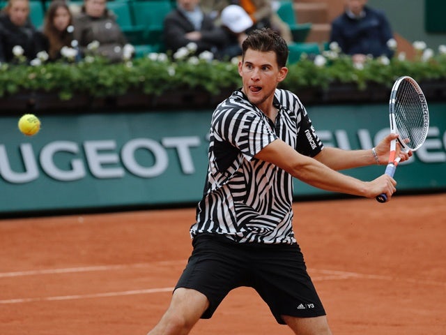 Dominic Thiem returns the ball to David Goffin during the quarter-finals of the French Open on June 2, 2016