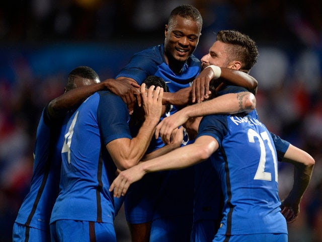 Laurent Koscielny of France (R) celebrates his team's third goal with teammates during the International Friendly between France and Scotland on June 4, 2016 in Metz, France