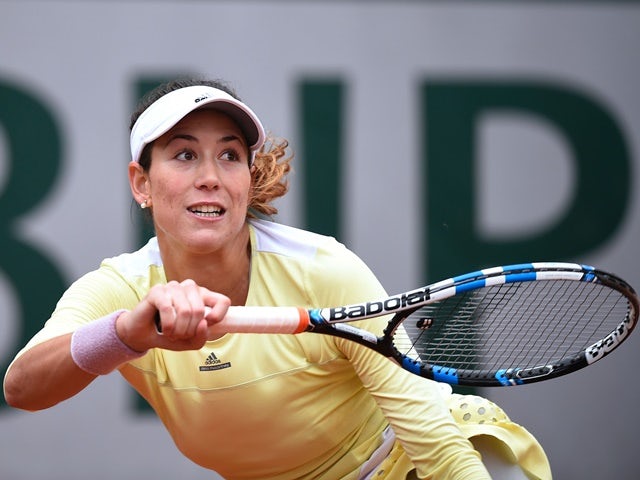 Garbine Muguruza returns the ball to Samantha Stosur during their women's semi-final match at the French Open on June 3, 2016