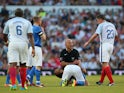 Referee Howard Webb looks to Jamie Carragher of England after a tackle on Shayne Ward of Rest of the World during the Soccer Aid 2016 match in aid of UNICEF at Old Trafford on June 5, 2016 