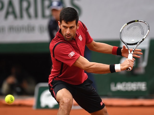 Novak Djokovic hits a backhand in the quarter-final against Tomas Berdych at the French Open on June 2, 2016