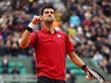 Novak Djokovic celebrates victory against Dominic Thiem in the French Open semis on June 3, 2016