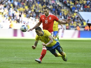 Mikael Lustig of Sweden and Sam Vokes of Wales during the international friendly on June 5, 2016
