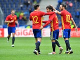 Spain's players celebrate after scoring during the international friendly football match against South Korea on June 1, 2016