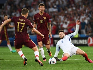 Adam Lallana and Oleg Shatov in action during the Euro 2016 Group B game between England and Russia on June 11, 2016