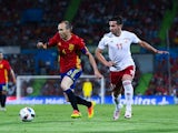 Andres Iniesta of Spain competes for the ball with Chanturia of Georgia during an international friendly on June 7, 2016