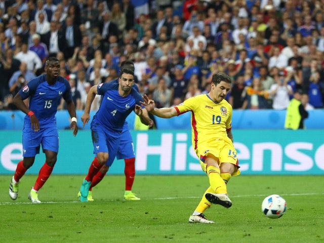 Bogdan Stancu of Romania converts the penalty to score his team's first goal during the UEFA Euro 2016 Group A match between France and Romania at Stade de France on June 10, 2016 in Paris, Franc