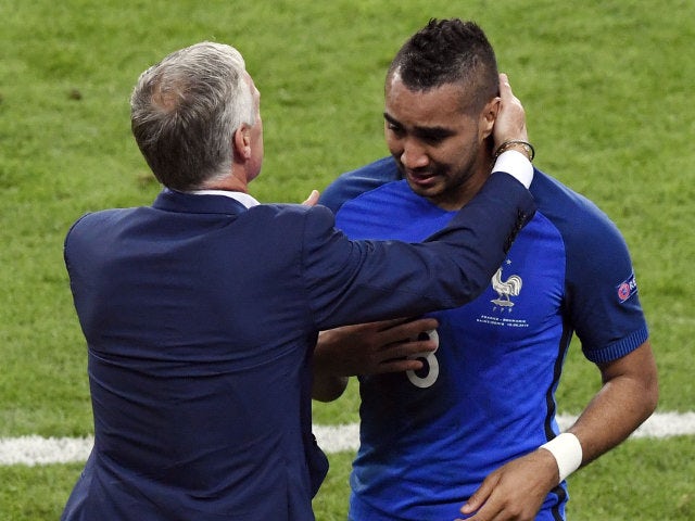 France's forward Dimitri Payet (R) is congratulated by France's coach Didier Deschamps after scoring the 2-1 goal during the Euro 2016 group A football match between France and Romania at Stade de France, in Saint-Denis, north of Paris, on June 10, 2016