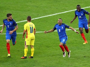 Dimitri Payet of France celebrates scoring his team's second goal during the UEFA Euro 2016 Group A match between France and Romania at Stade de France on June 10, 2016 in Paris, France