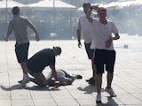 An England fan is unconscious on the ground after clashes ahead of the game against Russia on June 11, 2016